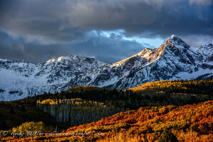 snowy mountain and fall foliage
